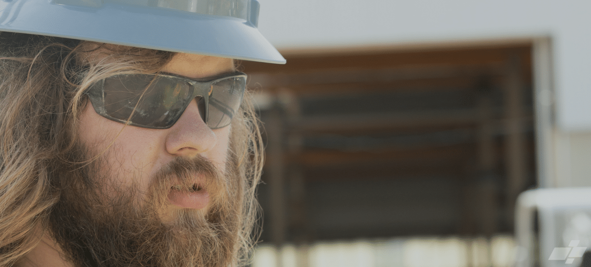 upclose image of Austin wearing grey hardhat