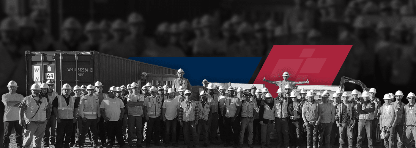 Black and white group image of many IES employees at a jobsite
