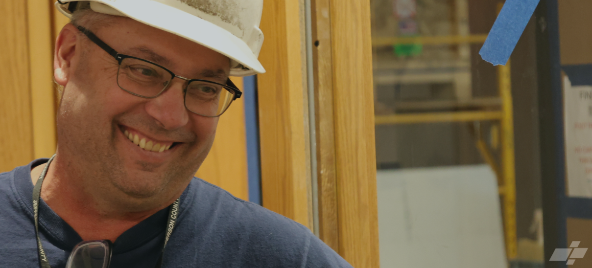 Dean Batcher in white hardhat smiling